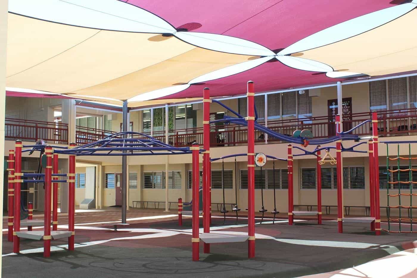 Shade sails over the playground and buildings at a Townsville school